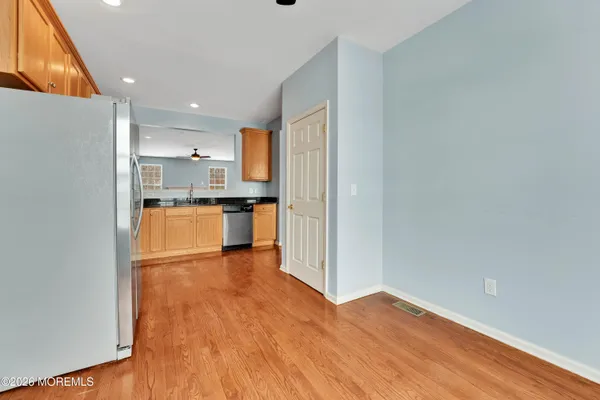 a view of kitchen with wooden floor