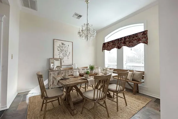 a kitchen with granite countertop a sink a counter space cabinets and stainless steel appliances
