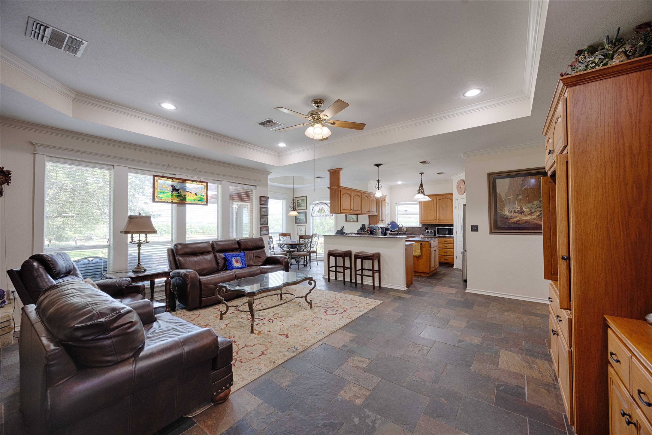 900 Schulze Road Muldoon, TX 78949 - Photo 13 of 44 a living room with furniture ceiling fan and a large window