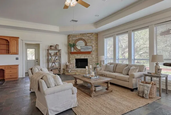 a kitchen with stainless steel appliances granite countertop a refrigerator a stove and a sink