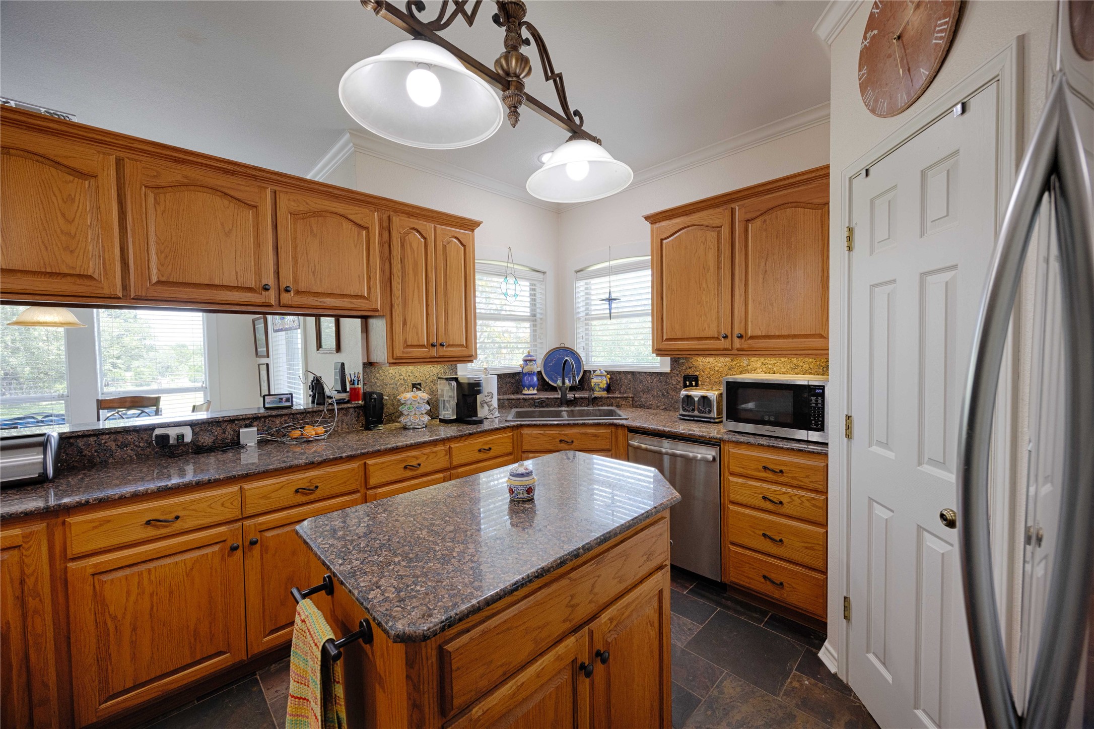 900 Schulze Road Muldoon, TX 78949 - Photo 15 of 47 a kitchen with stainless steel appliances granite countertop a sink a stove and a wooden floors
