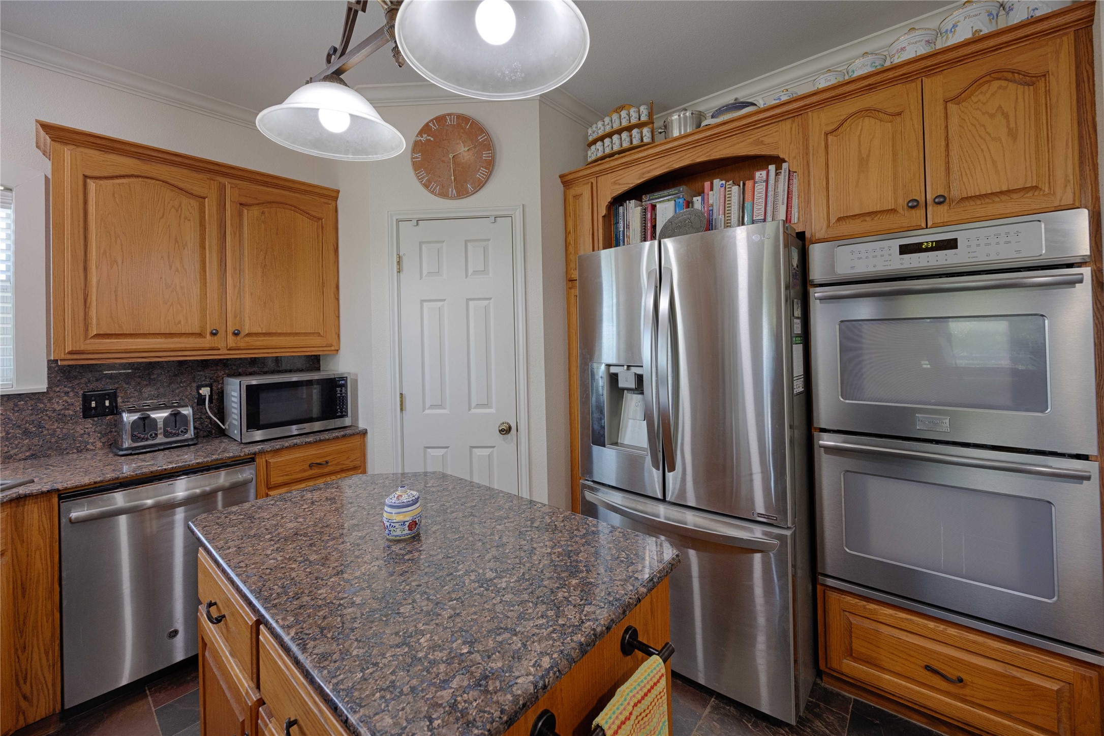 900 Schulze Road Muldoon, TX 78949 - Photo 17 of 47 a kitchen with stainless steel appliances granite countertop a refrigerator a stove and a sink