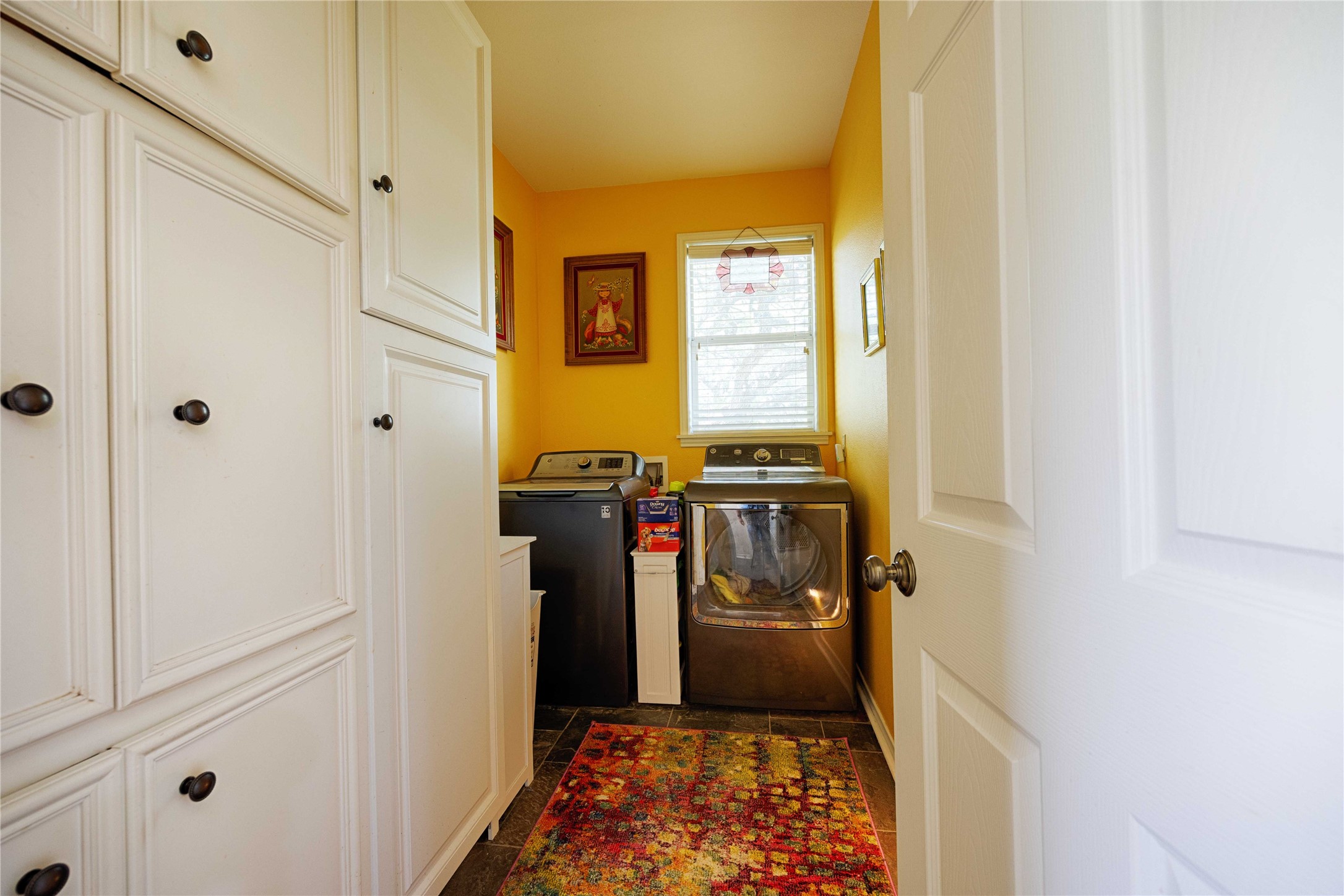 900 Schulze Road Muldoon, TX 78949 - Photo 19 of 44 a view of a hallway with wooden floor and a bathroom