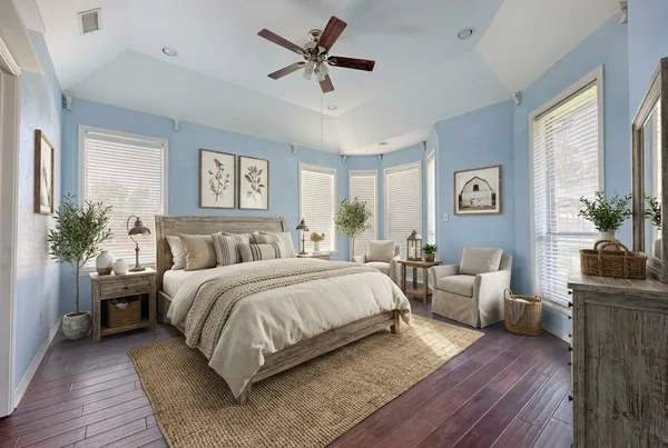 a bedroom with a bed and a chandelier