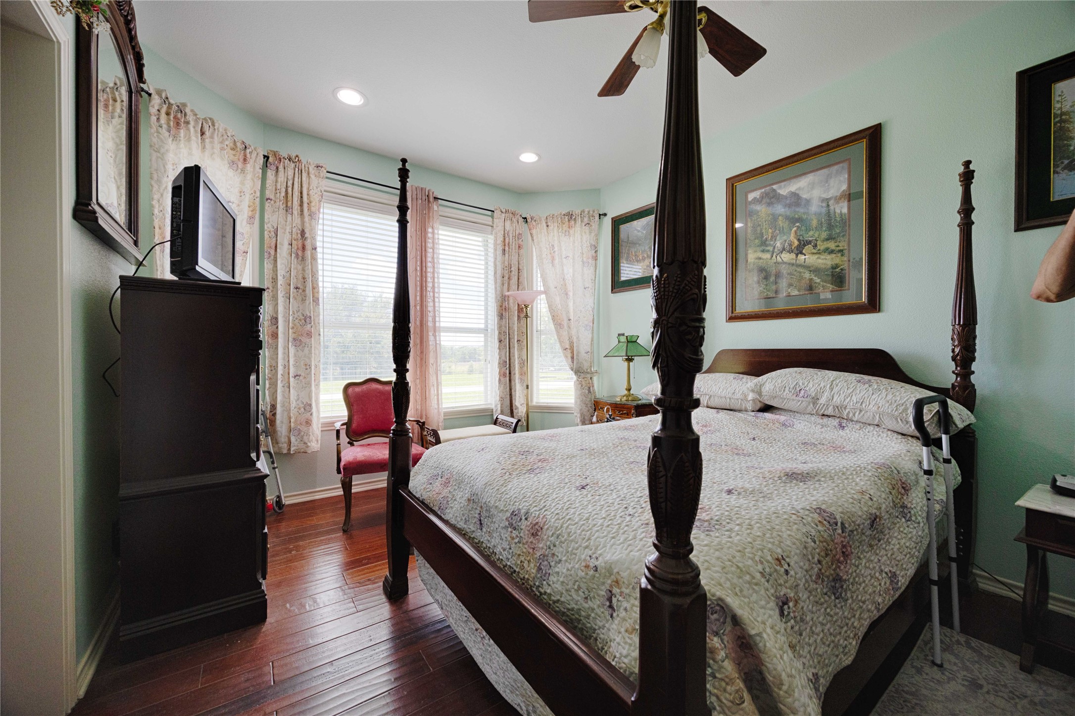 900 Schulze Road Muldoon, TX 78949 - Photo 27 of 47 a bedroom with a bed and a chandelier