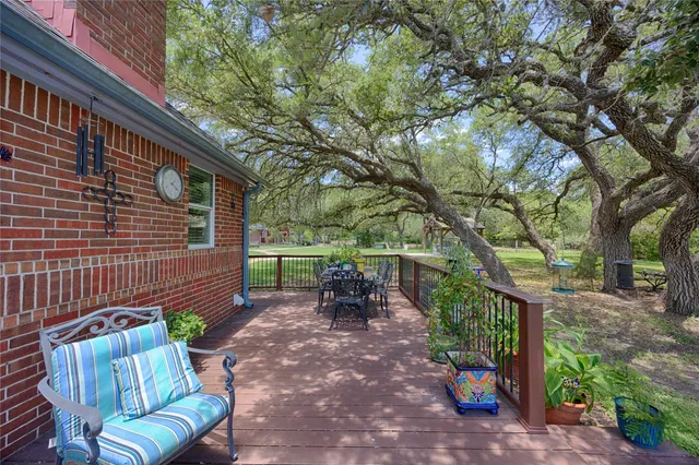 a backyard of a house with outdoor seating