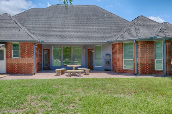 a view of a lake with houses in the back