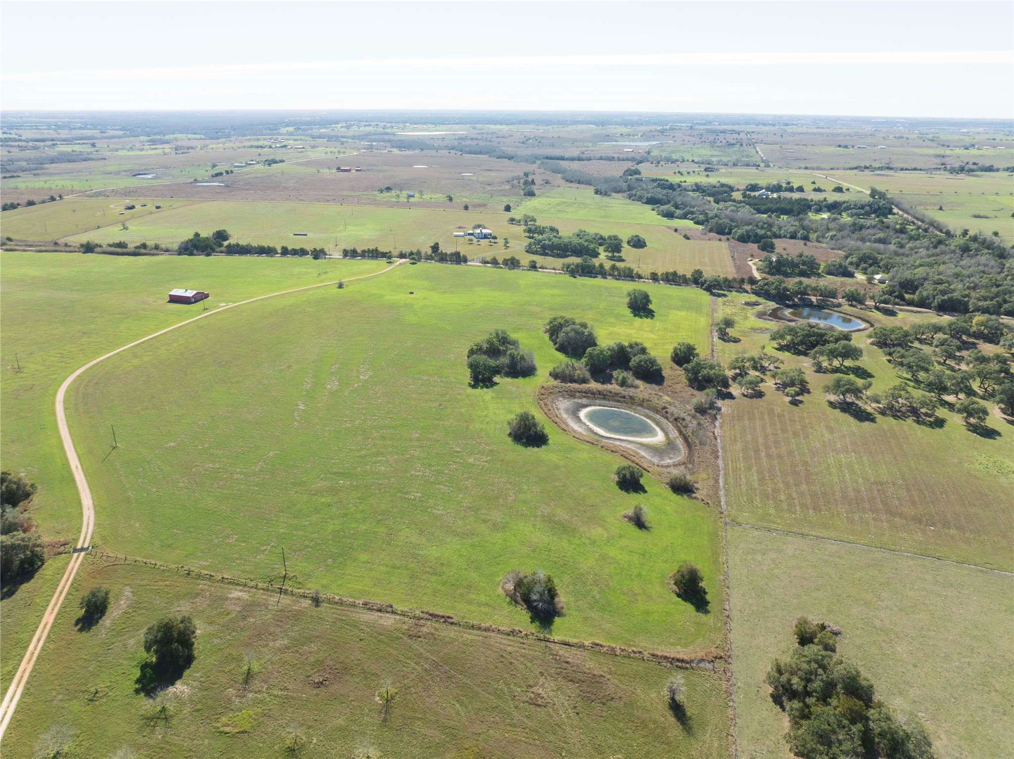 900 Schulze Road Muldoon, TX 78949 - Photo 4 of 47 an aerial view of a residential houses with outdoor space