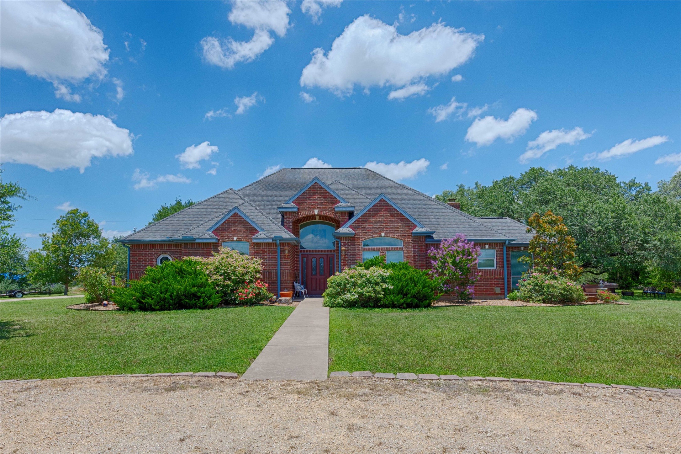 900 Schulze Road Muldoon, TX 78949 - Photo 4 of 44 a front view of a house with a yard