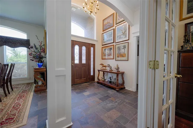 a kitchen with stainless steel appliances granite countertop a sink a stove and a wooden floors