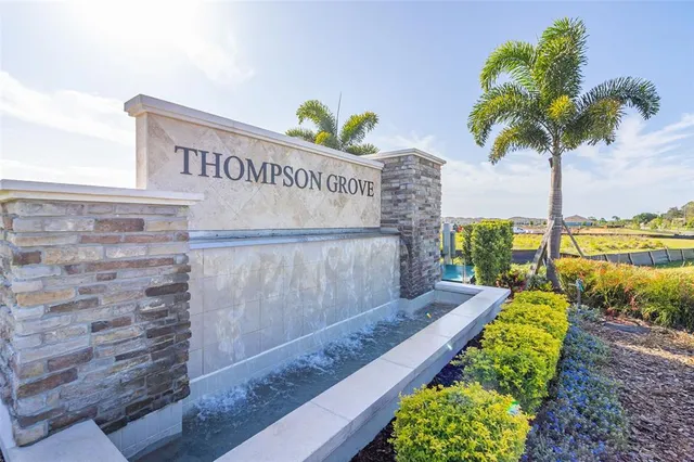 a view of a garden with an ocean view