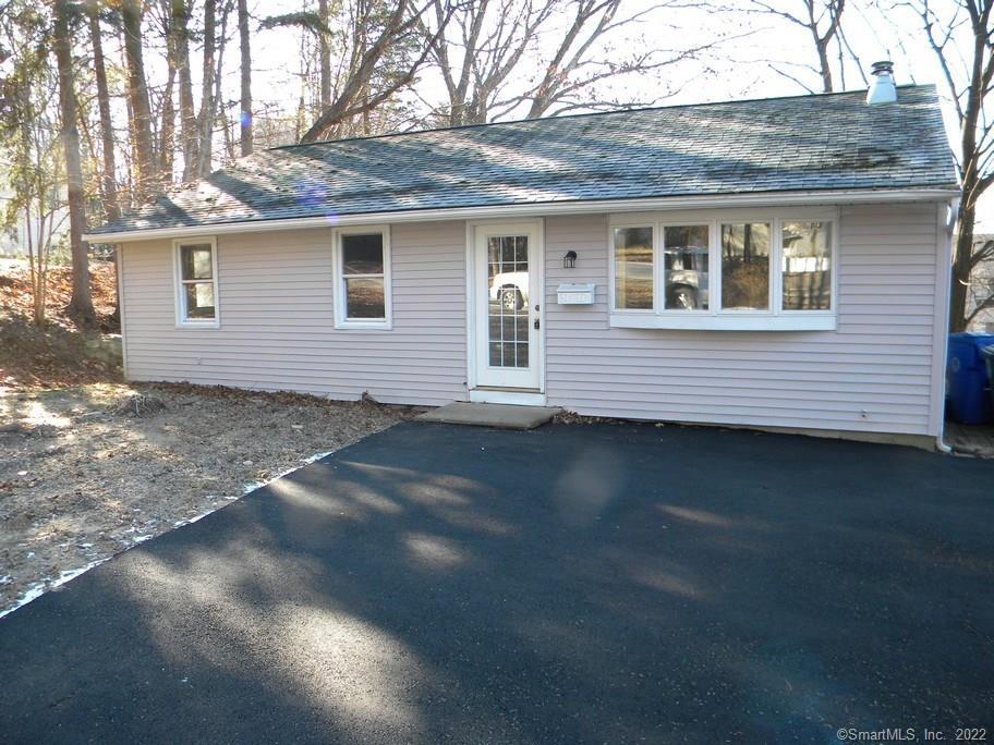 16 Torrington Heights Road Torrington, CT 06790 - Photo 1 of 1 a front view of a house with a garden
