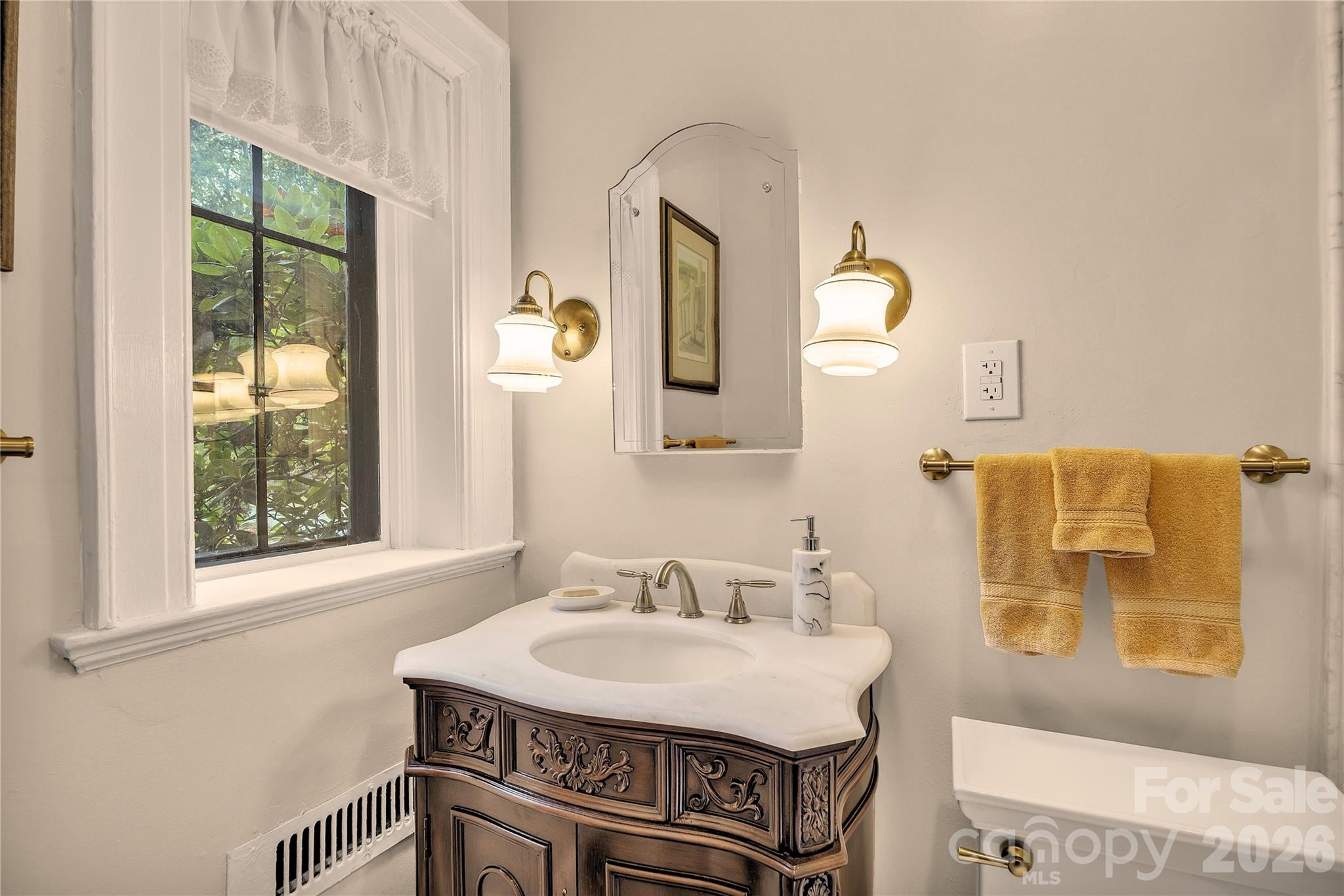 5510 South Main Street Salisbury, NC 28147 - Photo 16 of 43 a bathroom with a sink and a mirror