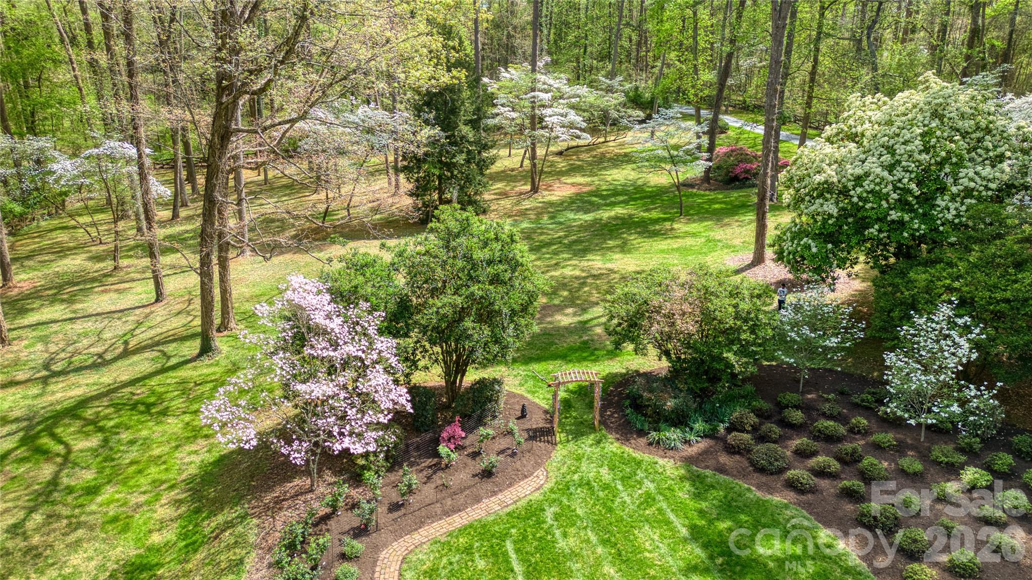 5510 South Main Street Salisbury, NC 28147 - Photo 36 of 43 a view of a garden with plants and large trees