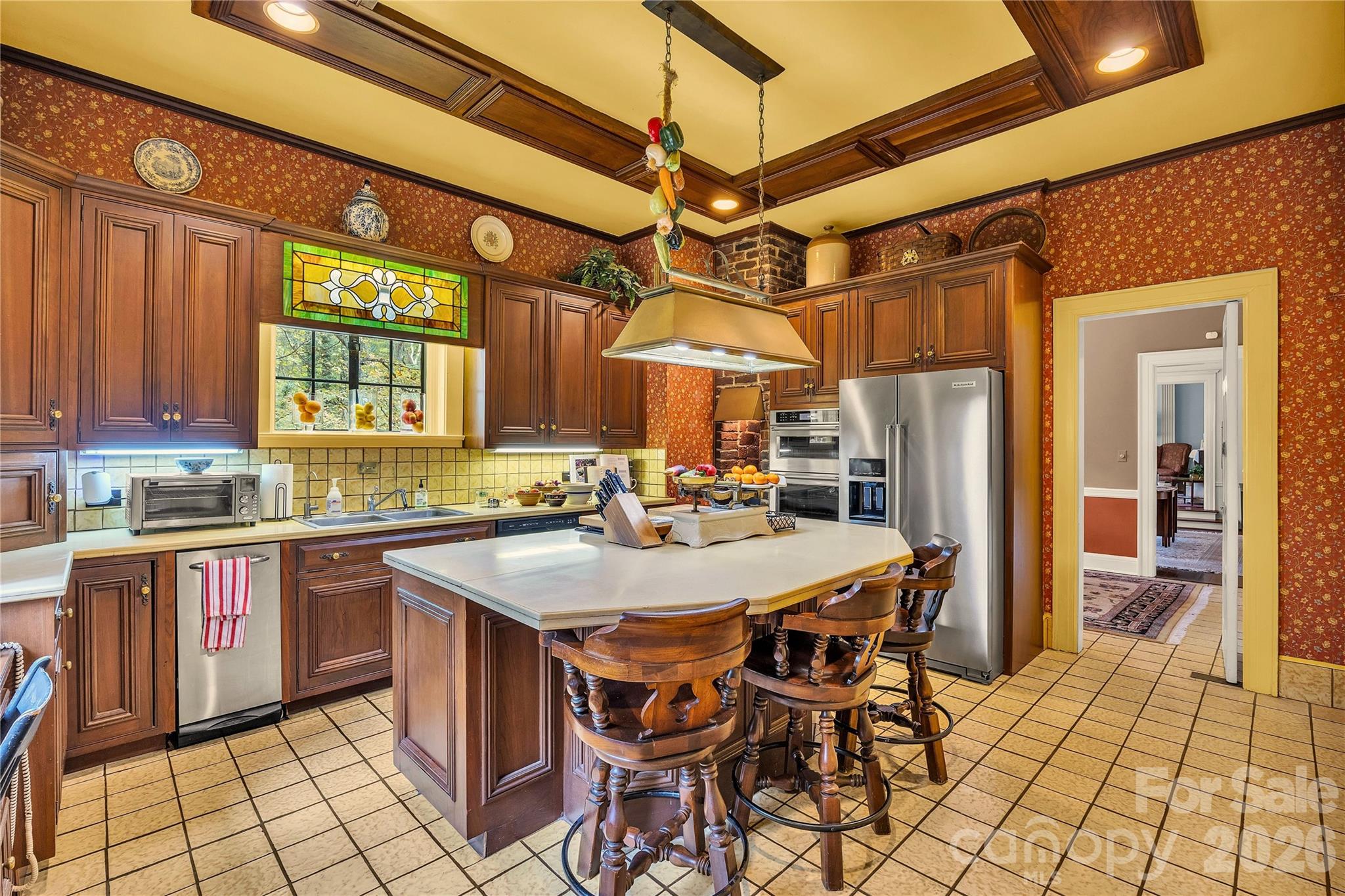 5510 South Main Street Salisbury, NC 28147 - Photo 10 of 43 a kitchen with stainless steel appliances a table chairs and a refrigerator