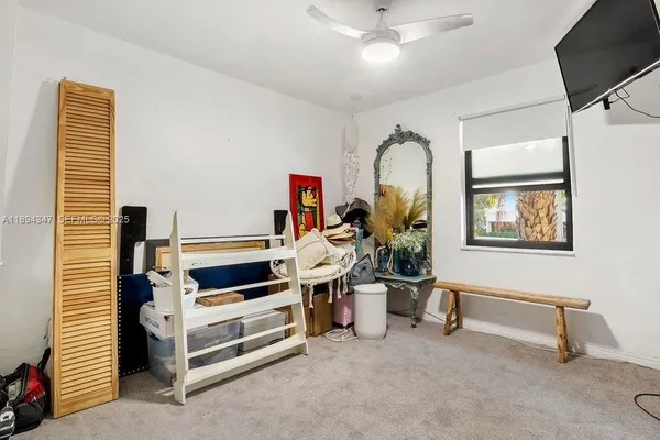 a view of living room and workspace