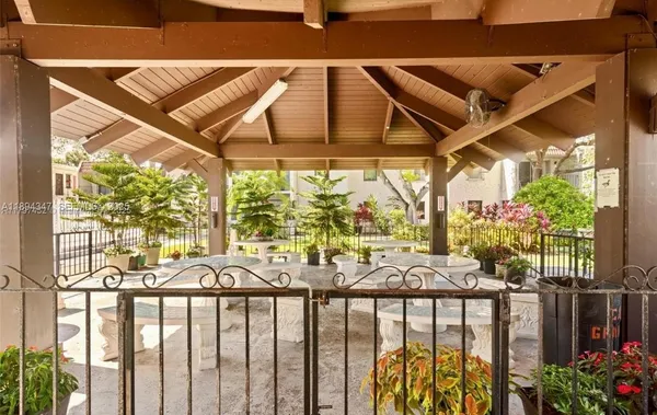 a view of a chairs and table in the patio