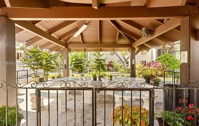 a view of a chairs and table in the patio