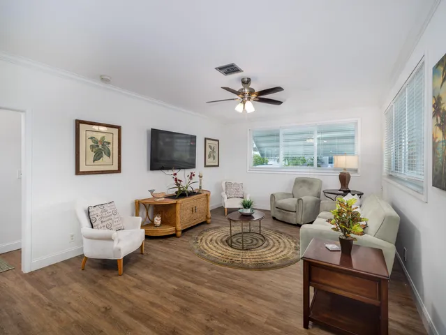 a living room with furniture fireplace and a flat screen tv