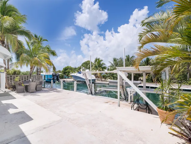 a view of a chairs and table in the patio
