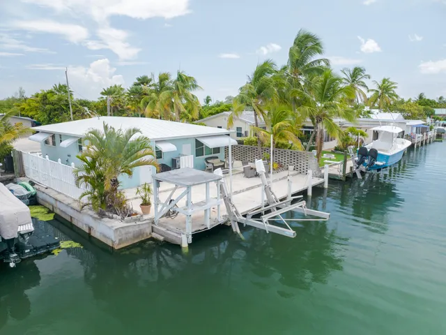 a view of swimming pool with outdoor seating and plants