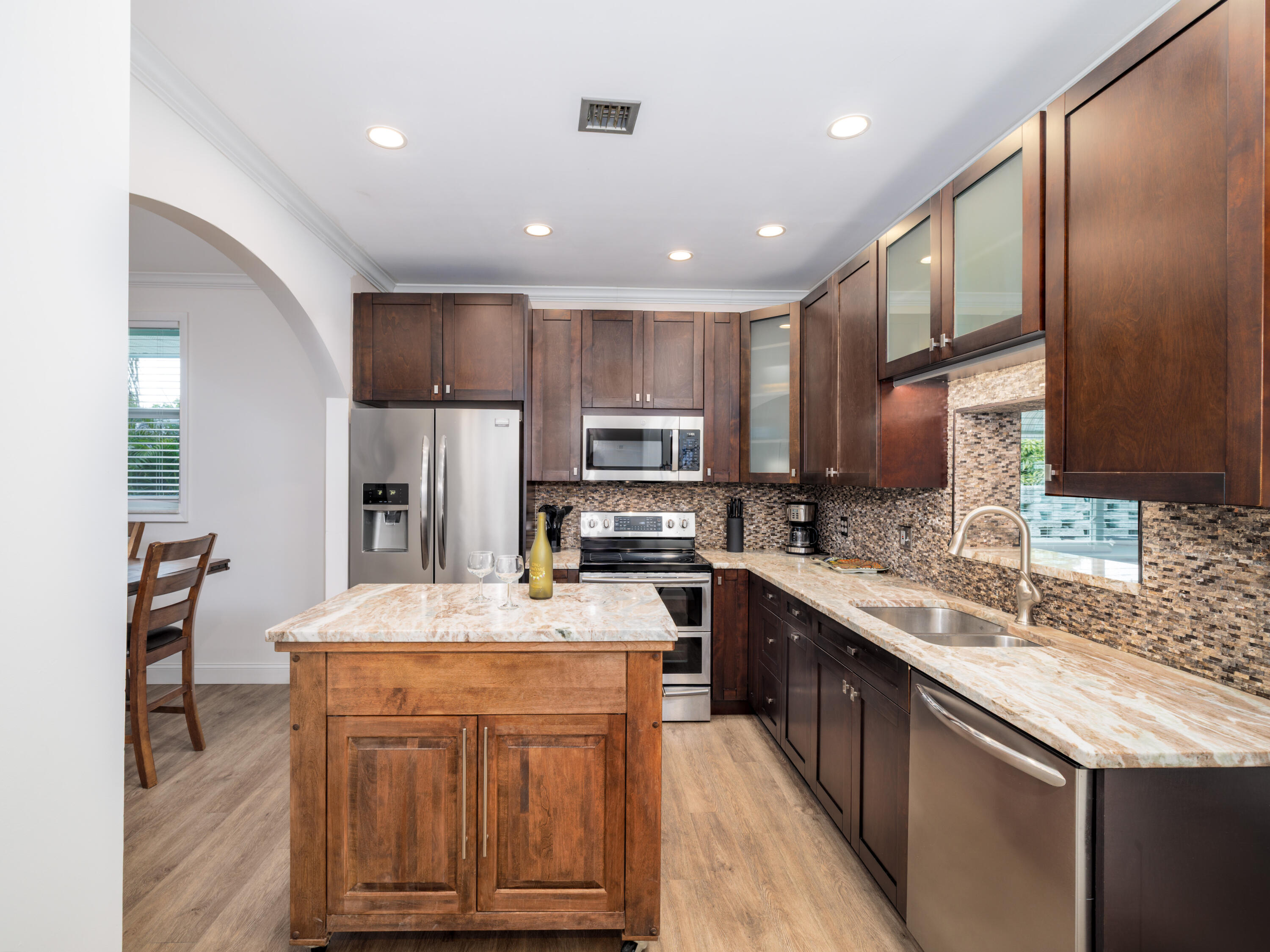 599 30th Street Marathon, FL 33050 - Photo 8 of 43 a kitchen with kitchen island granite countertop a sink stove and refrigerator