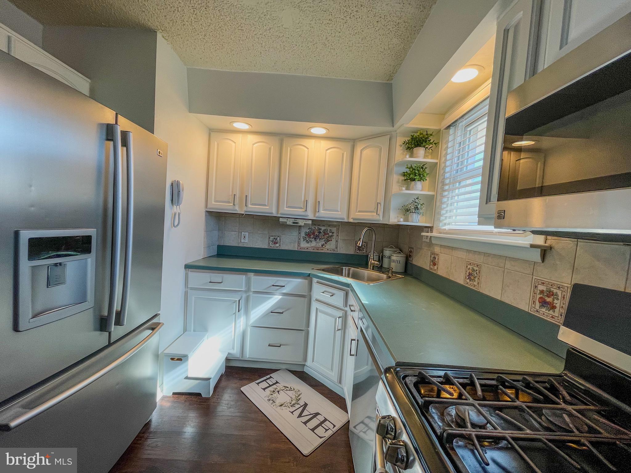 3445 Fitler Street Philadelphia, PA 19114 - Photo 11 of 32 a kitchen with a sink appliances and cabinets
