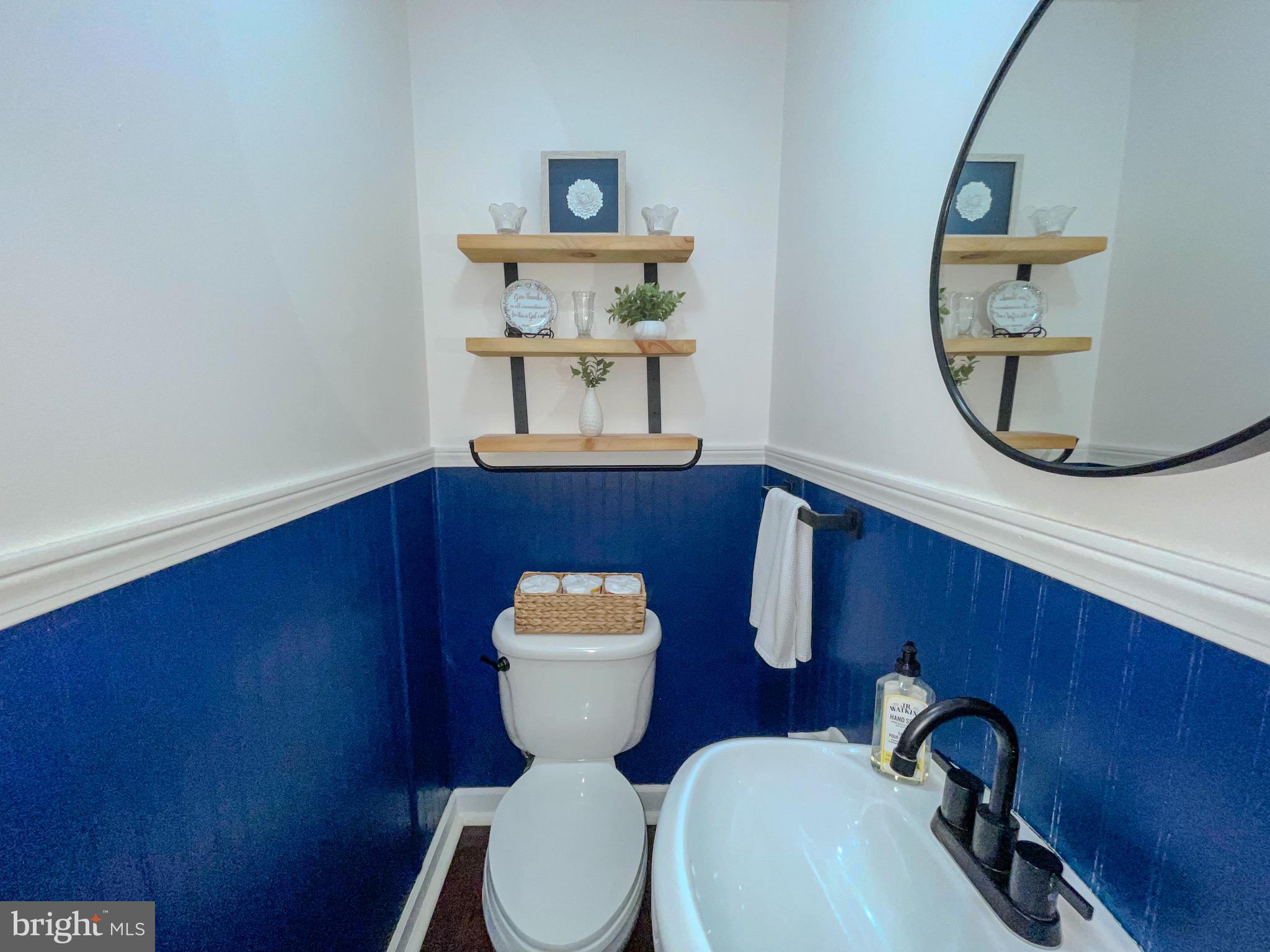 3445 Fitler Street Philadelphia, PA 19114 - Photo 14 of 32 a bathroom with a toilet a sink and mirror
