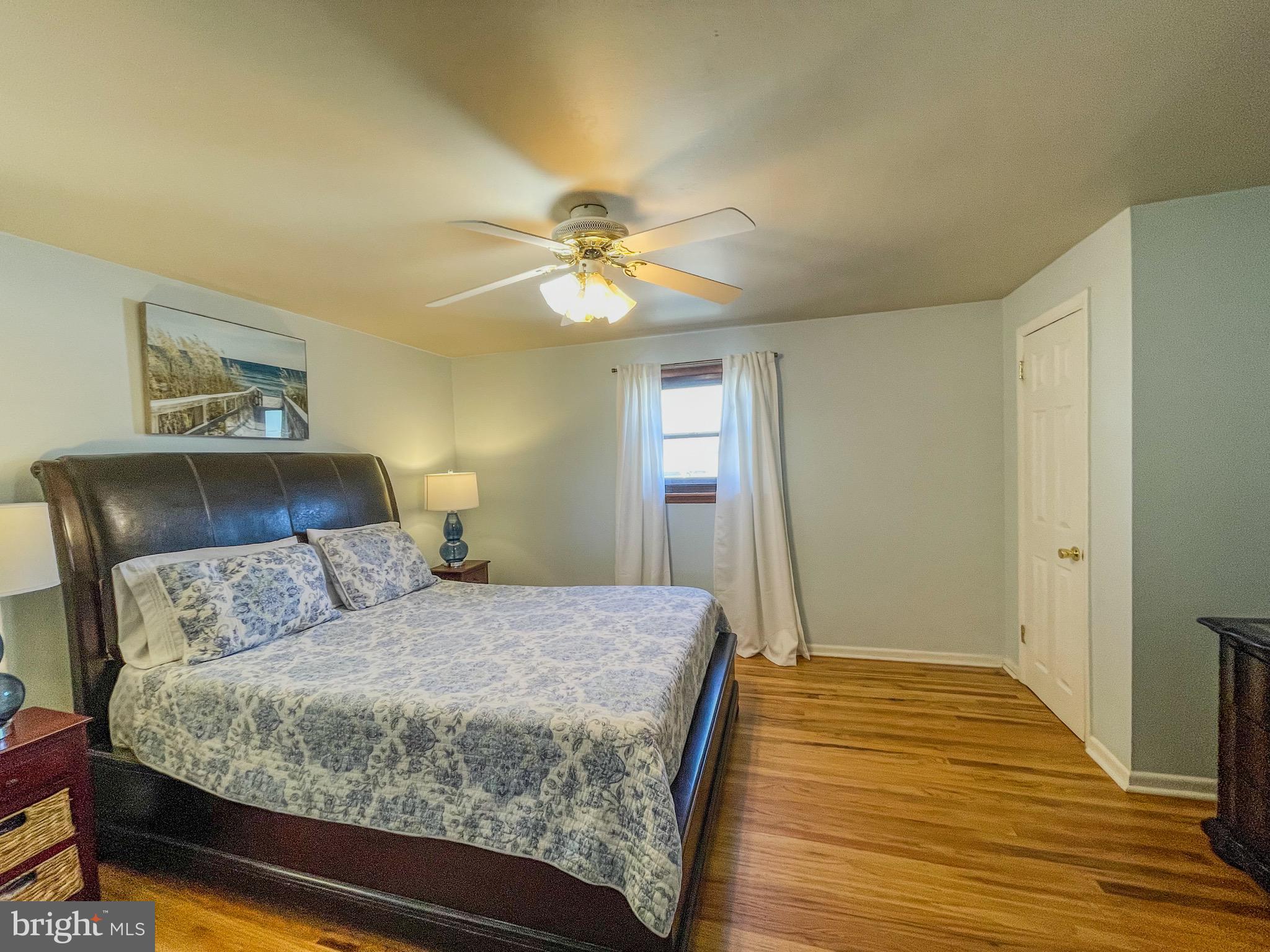 3445 Fitler Street Philadelphia, PA 19114 - Photo 15 of 32 a bedroom with a bed and a chandelier