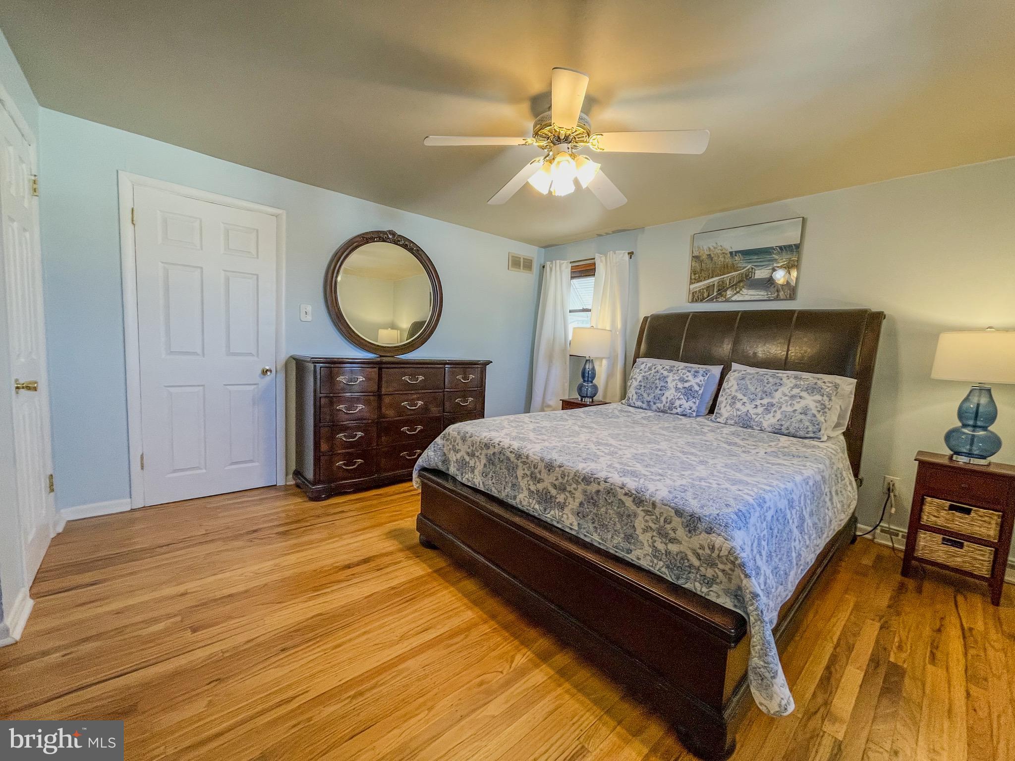 3445 Fitler Street Philadelphia, PA 19114 - Photo 16 of 32 a bedroom with a bed and a chandelier