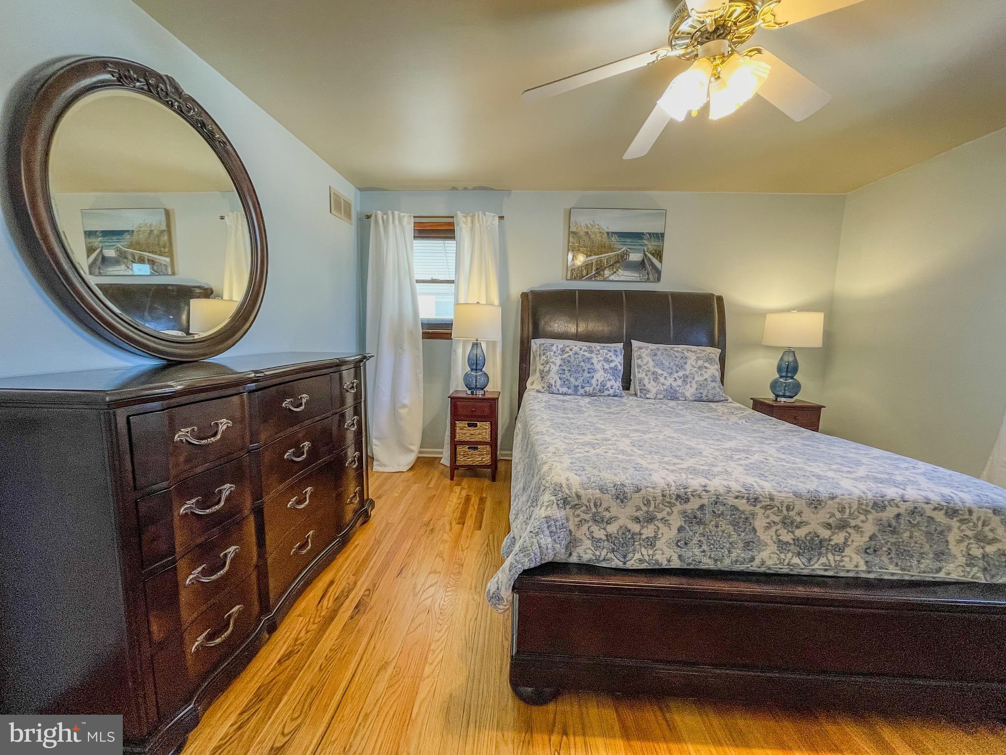 3445 Fitler Street Philadelphia, PA 19114 - Photo 17 of 32 a bedroom with a bed and a mirror on the dresser