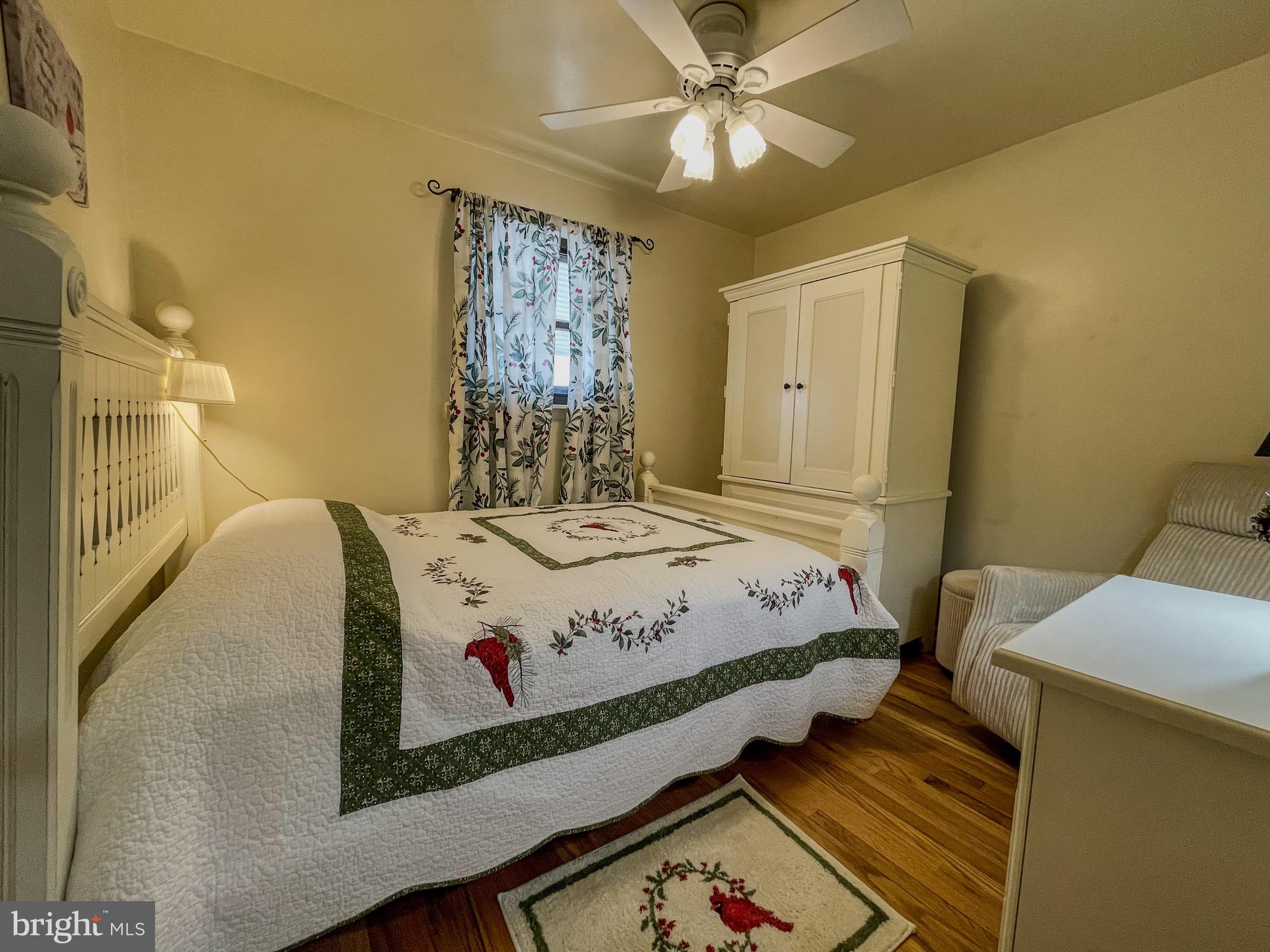 3445 Fitler Street Philadelphia, PA 19114 - Photo 20 of 32 a bedroom with a bed and a chandelier