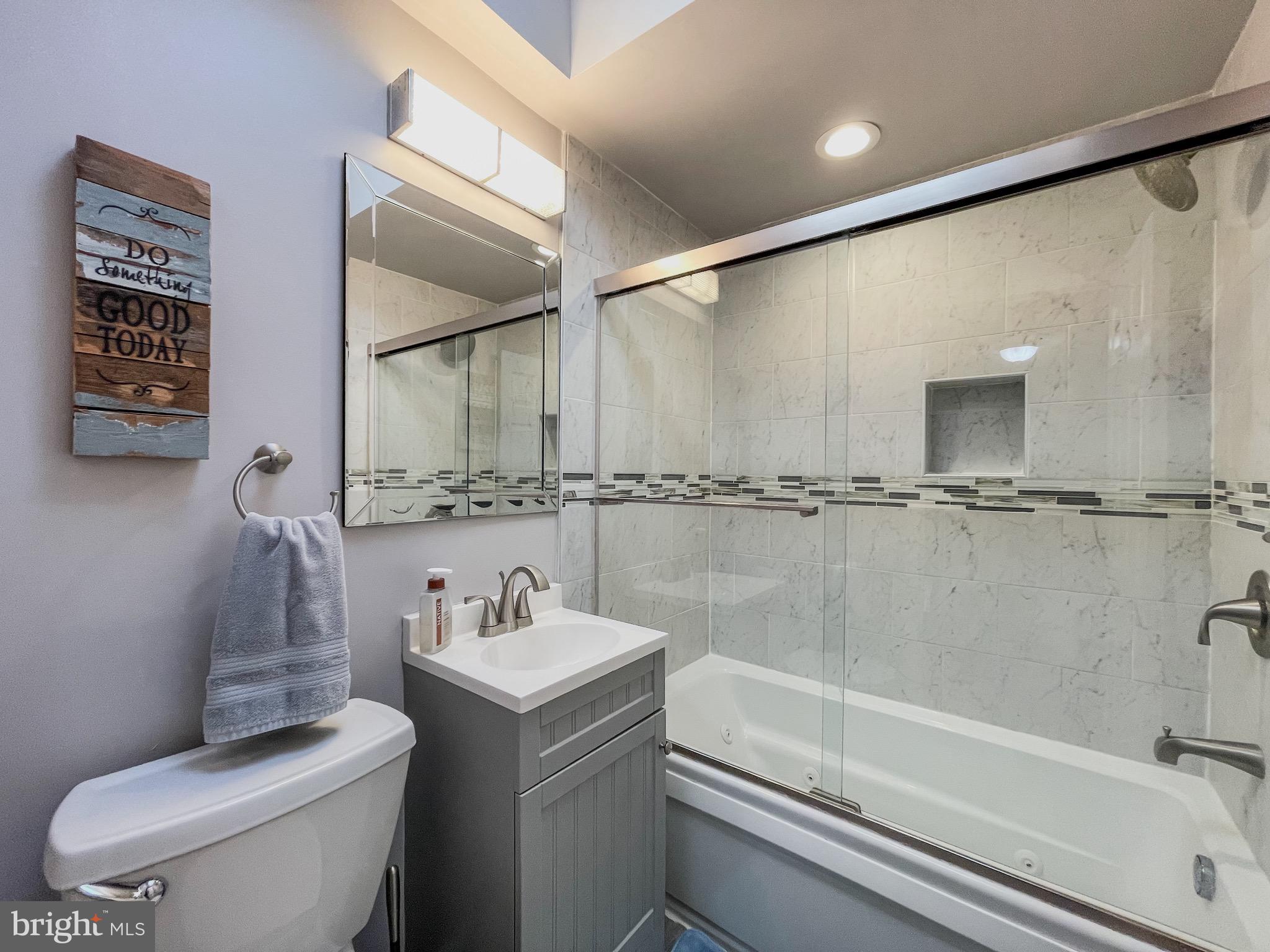 3445 Fitler Street Philadelphia, PA 19114 - Photo 22 of 32 a bathroom with a sink a toilet and shower