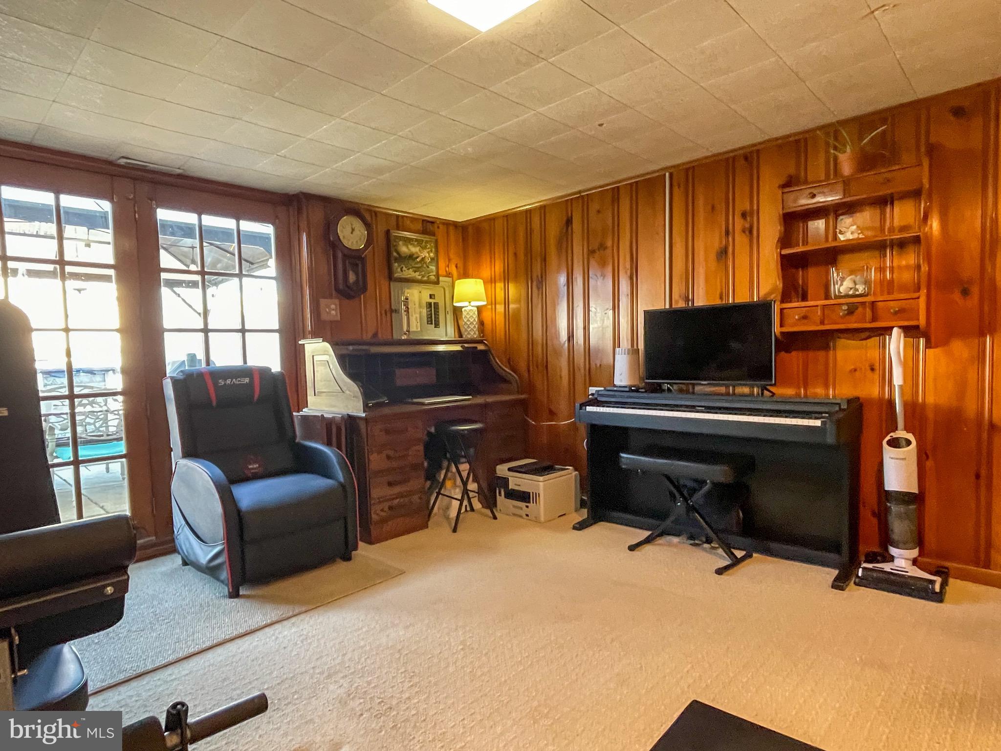 3445 Fitler Street Philadelphia, PA 19114 - Photo 25 of 32 a living room with furniture gym equipment and a flat screen tv