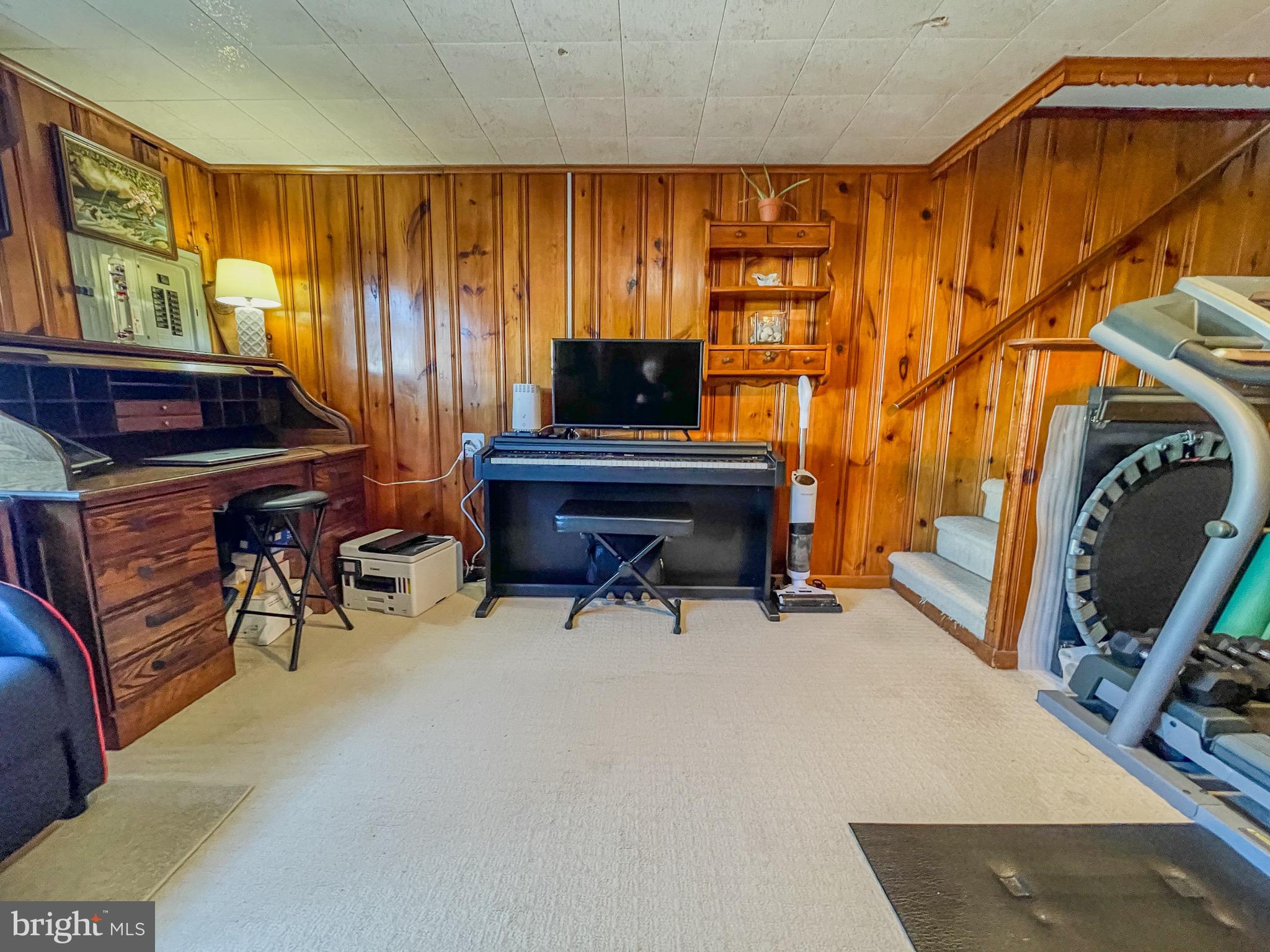 3445 Fitler Street Philadelphia, PA 19114 - Photo 26 of 32 a living room with furniture and a fireplace