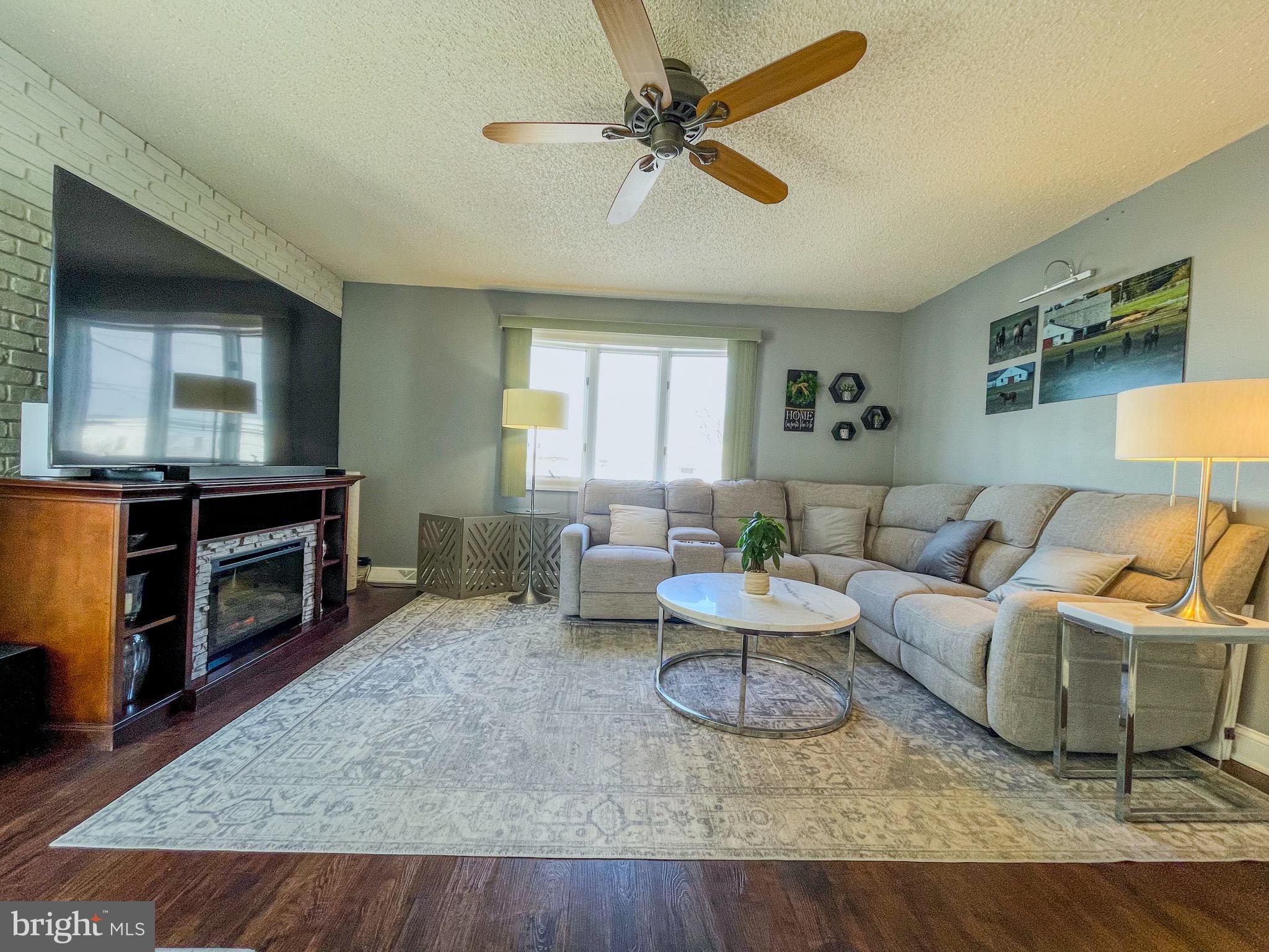 3445 Fitler Street Philadelphia, PA 19114 - Photo 3 of 32 a living room with furniture and a flat screen tv