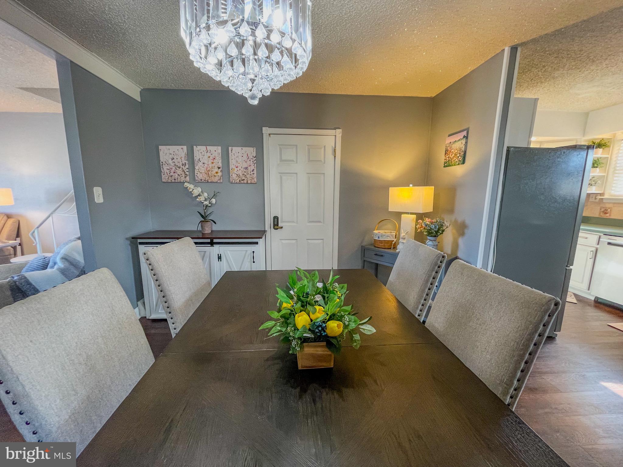 3445 Fitler Street Philadelphia, PA 19114 - Photo 8 of 32 a living room with furniture and a chandelier