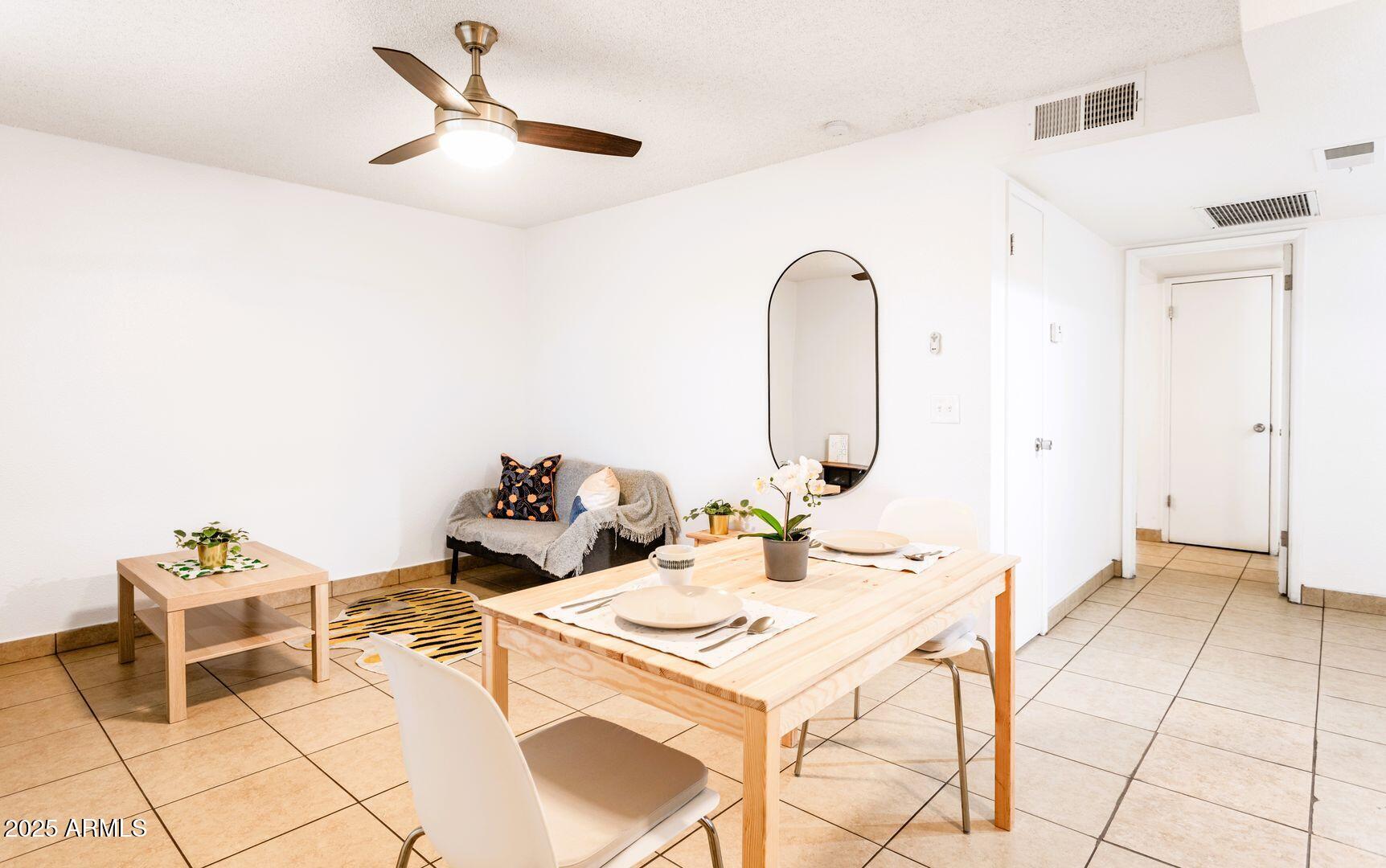1623 West Missouri Avenue, Unit 1 Phoenix, AZ 85015 - Photo 3 of 12 a living room with furniture