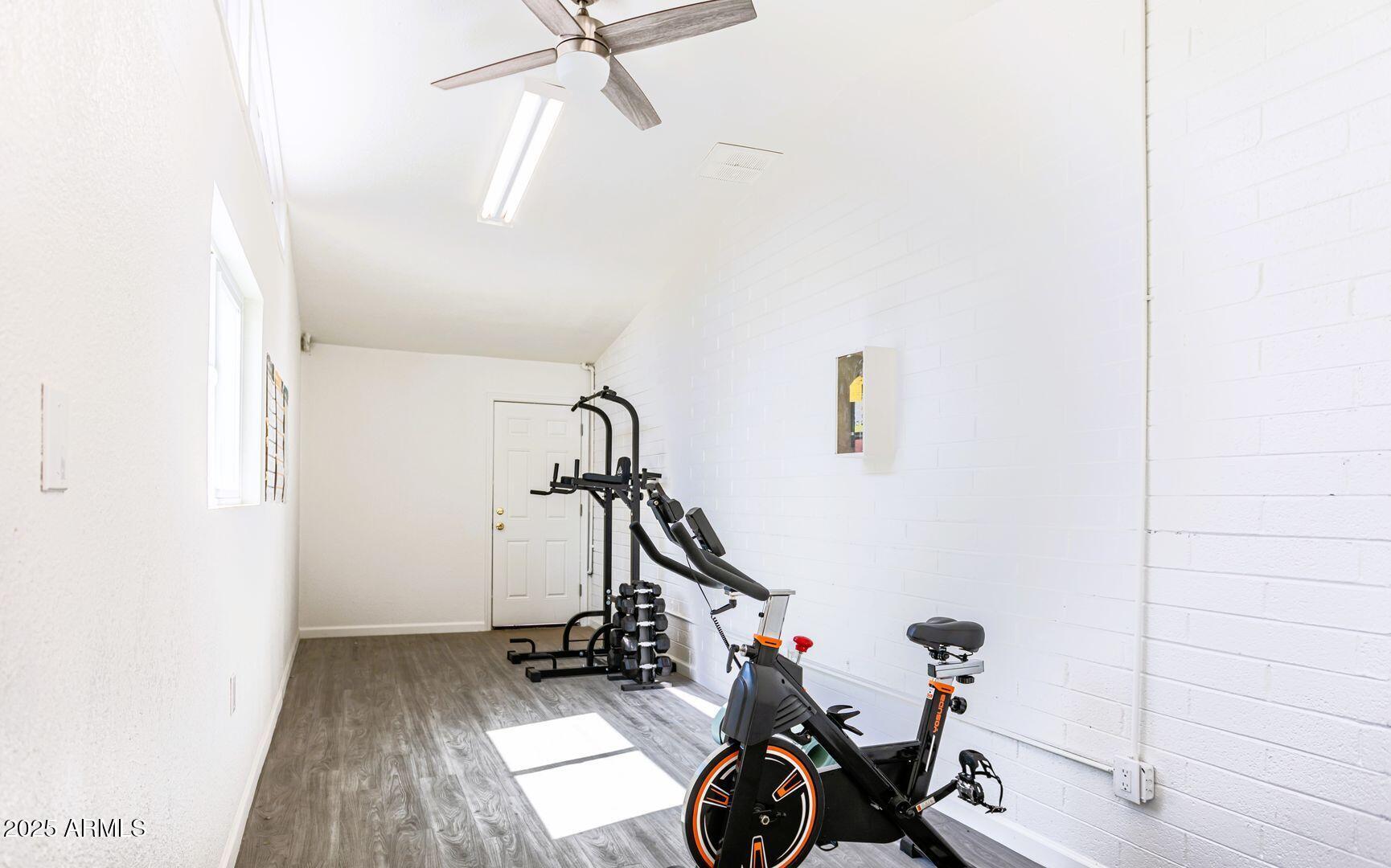1623 West Missouri Avenue, Unit 1 Phoenix, AZ 85015 - Photo 9 of 12 a view of a room with gym equipment