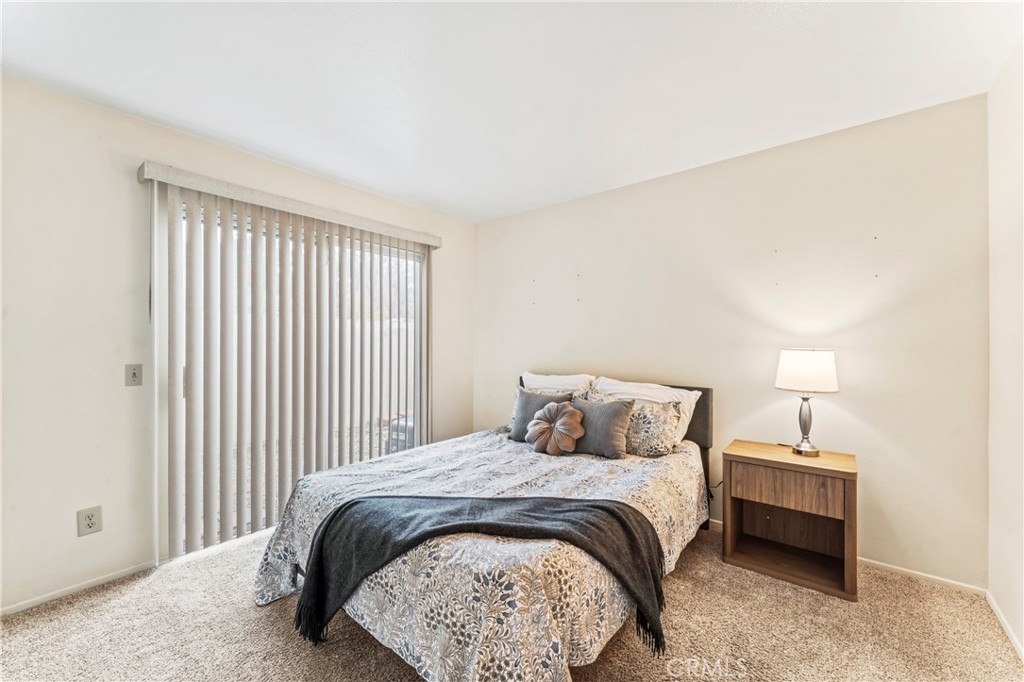 14720 Marymount Street Moorpark, CA 93021 - Photo 12 of 22 a bedroom with a bed and a night stand