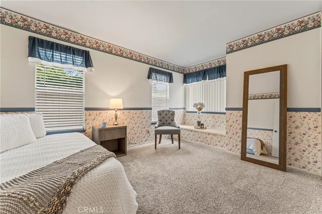 a bedroom with furniture and a fireplace