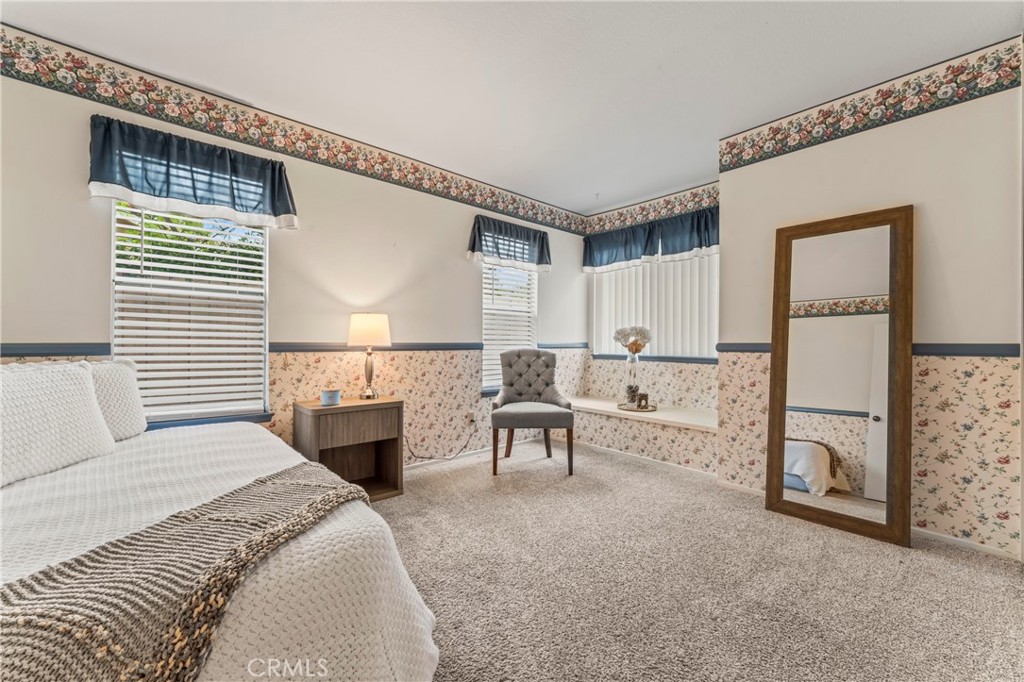 14720 Marymount Street Moorpark, CA 93021 - Photo 13 of 22 a bedroom with furniture and a fireplace