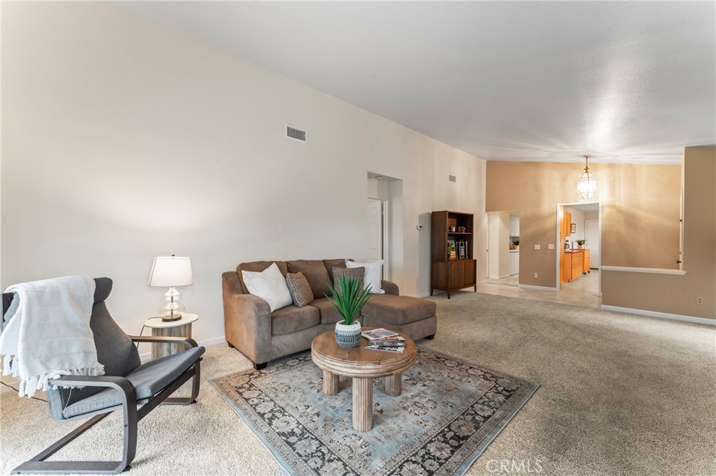 14720 Marymount Street Moorpark, CA 93021 - Photo 7 of 22 a living room with furniture and a potted plant
