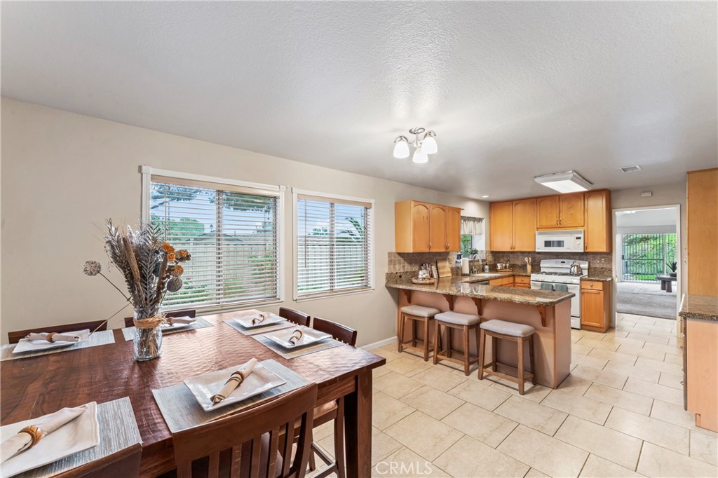 14720 Marymount Street Moorpark, CA 93021 - Photo 9 of 22 a view of a dining room with furniture window and outside view