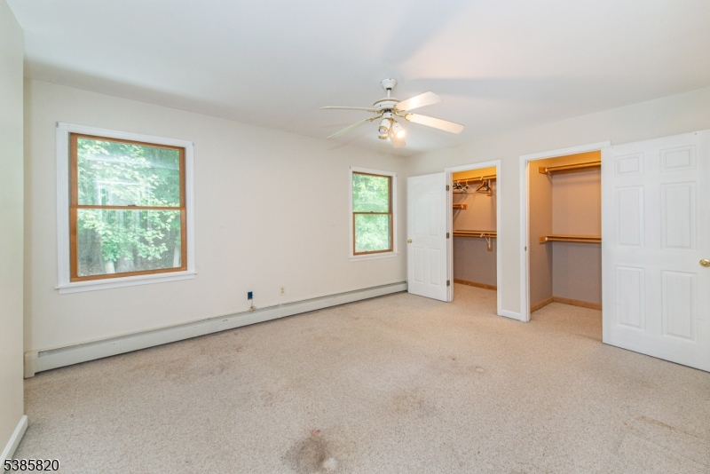 40 Castle Rock Road Lake Hopatcong, NJ 07849 - Photo 14 of 20 an empty room with chandelier fan and windows