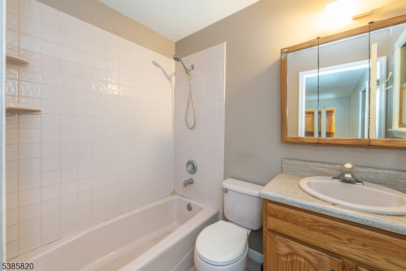 40 Castle Rock Road Lake Hopatcong, NJ 07849 - Photo 15 of 20 a bathroom with a sink toilet and shower