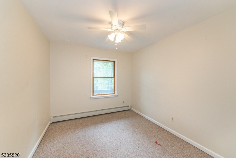 40 Castle Rock Road Lake Hopatcong, NJ 07849 - Photo 16 of 20 an empty room with a window and a fan