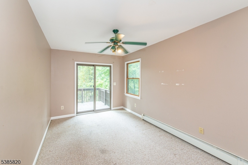 40 Castle Rock Road Lake Hopatcong, NJ 07849 - Photo 17 of 20 wooden floor in an empty room with a window