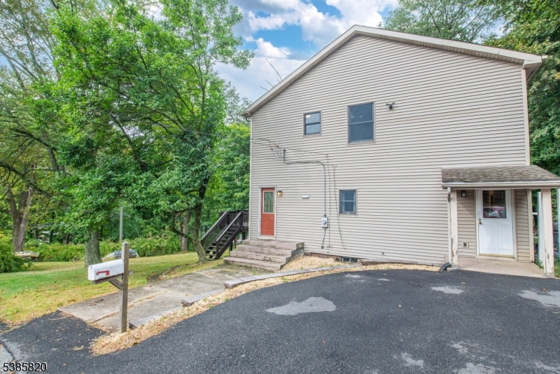 40 Castle Rock Road Lake Hopatcong, NJ 07849 - Photo 3 of 20 a view of a house with a yard