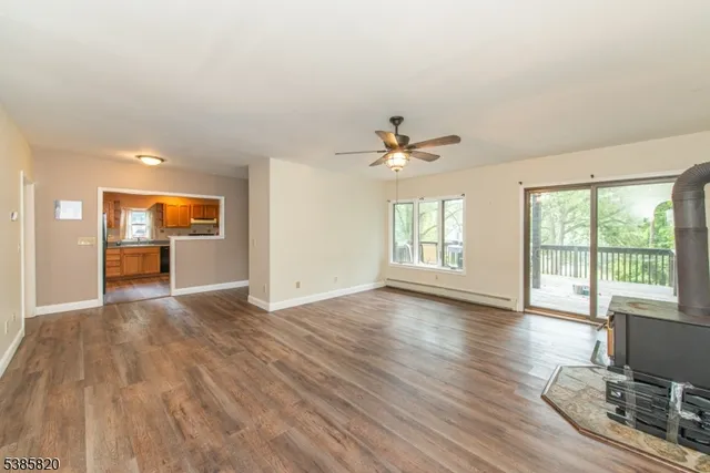 a view of livingroom with hardwood floor and ceiling fan